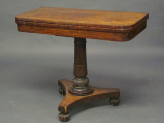 A William IV rosewood D shaped card table, raised on a turned column with triform base base, 36"