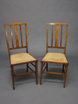 A pair of Edwardian inlaid mahogany rail back bedroom chairs