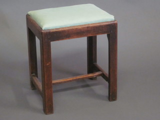 A 19th Century rectangular mahogany stool with upholstered seat, raised on square tapering supports with H framed stretcher  15"