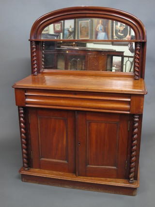 A Victorian mahogany chiffonier with arch shaped mirrored  back, raised on spiral turned columns, the base fitted a drawer  above a double cupboard enclosed by a panelled door, raised on a  platform base 42"