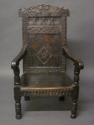 A carved oak Wainscot chair  ILLUSTRATED