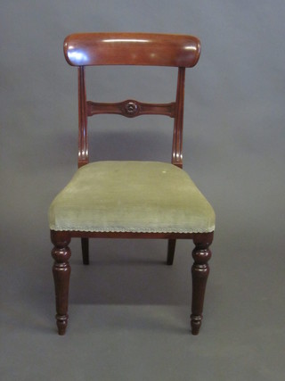 A Victorian mahogany bar back chair with carved mid rail and upholstered seat raised on turned supports