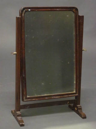 A 19th Century arched plate dressing table mirror contained in a mahogany swing frame 11 1/2"