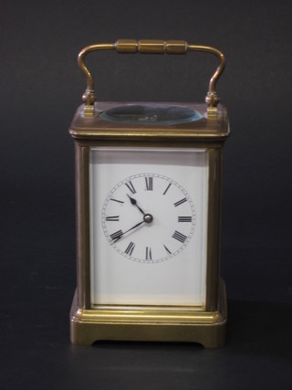 A French 19th Century 8 day carriage clock with enamelled dial  and Roman numerals, contained in a gilt metal case 4"   ILLUSTRATED