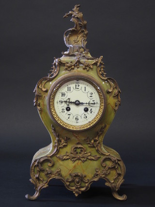 A 19th Century French 8 day striking mantel clock with  enamelled dial and Arabic numerals contained in a green porcelain and gilt ormolu mounted case  ILLUSTRATED