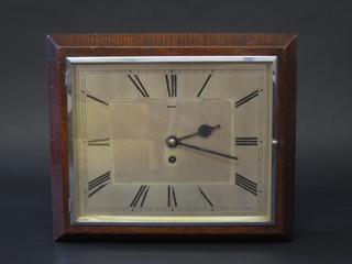 An Art Deco 8 day wall clock with square silvered dial and  Roman numerals