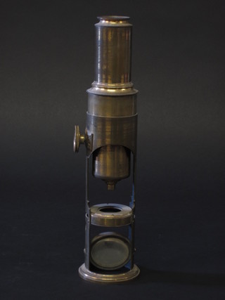 A student's brass single pillar microscope
