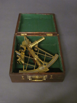 A reproduction brass sextant marked T Cook London, contained  in a mahogany case