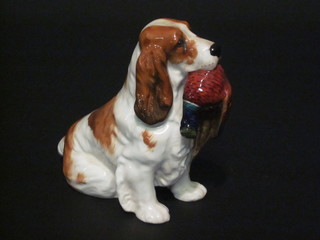 A Royal Doulton figure of a seated Spaniel with cock pheasant,  base marked H1028 5"