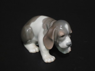 A Lladro figure of a seated dog 4"