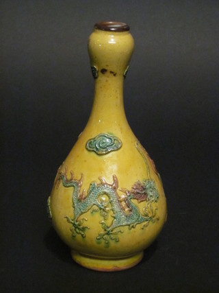 An Oriental yellow ground club shaped vase, the base with 6 character mark 8"
