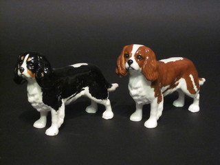 A pair of Beswick figures of a liver and white Spaniel and a black and white Spaniel, 4" and 1 other liver & white Spaniel 2 1/2"