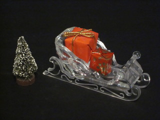 A Swarovski crystal figure of Santa's Sleigh with 2 presents and  a Christmas tree 4 1/2"