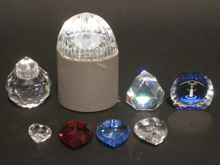 A Swarovski crystal octagonal candle holder together with 8 paperweights