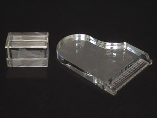 A Swarovski crystal paperweight commemorating Concord 1969-2003 together with a mirrored glass model of a grand piano