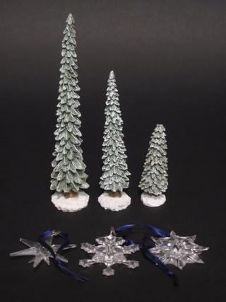 3 Swarovski crystal Christmas tree pendants in the form of stars together with 3 model Christmas trees