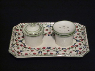 An Austrian rectangular pottery standish with ink well and sander with floral decoration 7 1/2", base signed
