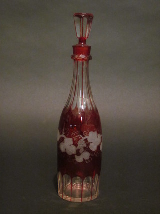 A Bohemian etched red overlay glass decanter and stopper of  club form 13"