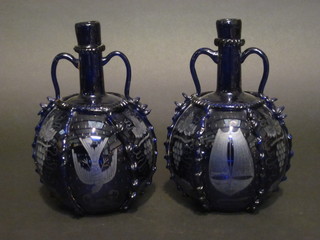 A pair of 19th Century etched Bristol blue glass decanters decorated grapes, ships and doves 9"  ILLUSTRATED