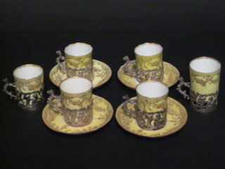 A 9 piece Continental coffee set comprising 4 saucers - 3  cracked, 6 coffee cans - 2 cracked, contained in silver cup holders