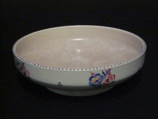 A circular Poole Pottery bowl with floral decoration, marked  Made in England Poole and incised 345 8"