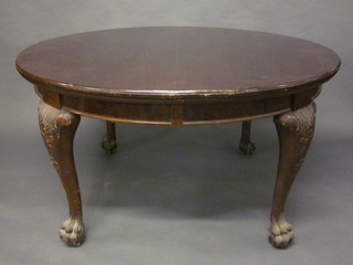 An Edwardian Chippendale style oval extending dining table,  no leaves, raised on cabriole ball and claw supports 54"