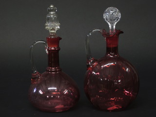 2 19th Century cranberry glass ewers and stoppers with clear  glass handles 10"