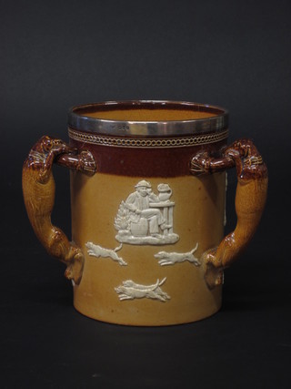 A Doulton Lambeth 3 handled stoneware loving cup decorated  hunting scene with silver band