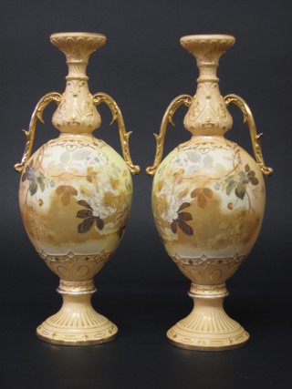 A pair of Worcester style blush ivory twin handled vases with floral decoration 14"