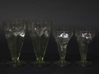 A suite of 10 Art Deco green glazed glasses comprising 6 large  wine and 4 small wine glasses