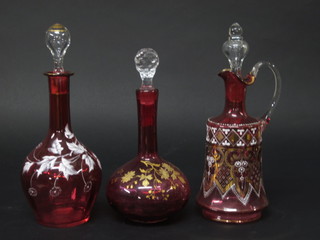 2 ruby glass club shaped decanters with enamelled decoration 9"  and a matching ewer 11"