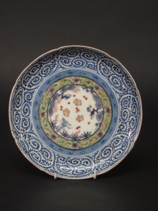 A circular Oriental blue and white plate with floral decoration the reverse with 6 character mark 8"