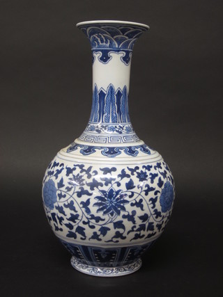An Oriental blue and white club shaped vase with floral  decoration, the base with 6 character mark 15"