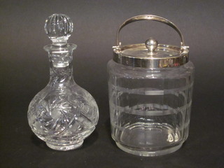 A cut glass biscuit barrel with silver plated lid, together with a  cut glass decanter and stopper 7"
