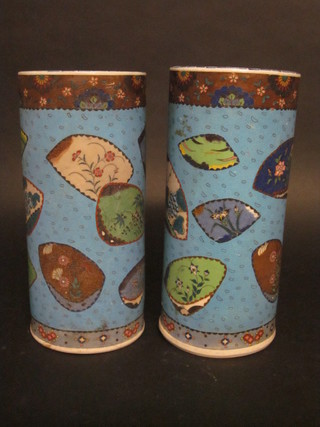 A pair of Oriental blue glazed cylindrical vases with panelled decoration, the bases with 3 character mark, 12" f and r,