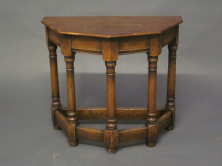 An oak Credence table, raised on turned and block supports 23"