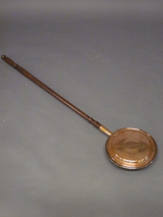 A 19th Century copper warming pan with turned fruitwood  handle