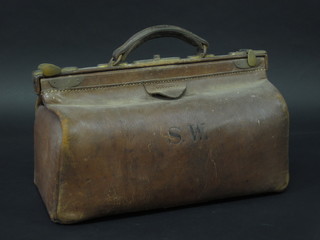 A brown leather Gladstone bag 16"