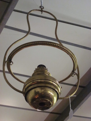 A brass hanging oil lamp