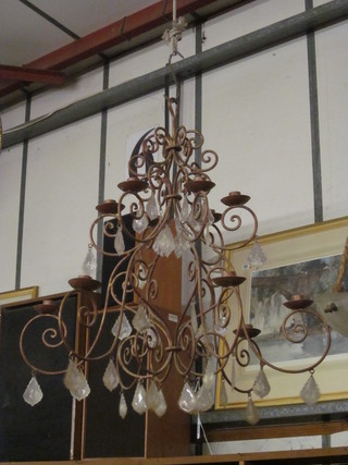 A wrought iron 12 light chandelier