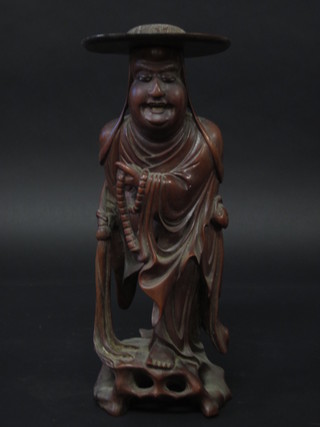 An Eastern carved rootwood figure of a standing sage 14"