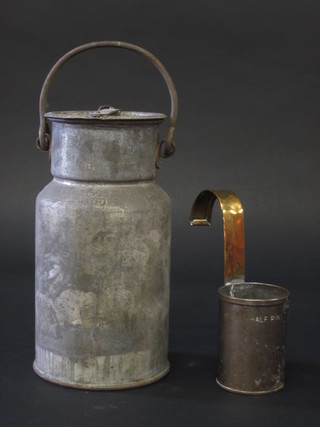 A cylindrical metal milk churn marked FM 10" and a George V  milk measure