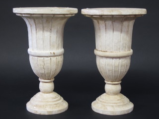 A pair of white painted turned wooden urns 11"