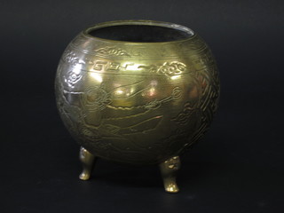An Oriental brass circular jar with engraved decoration 6"