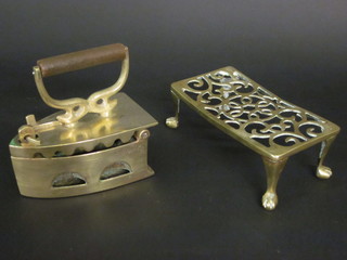 A brass box iron marked Hong Aun together with a brass  footman
