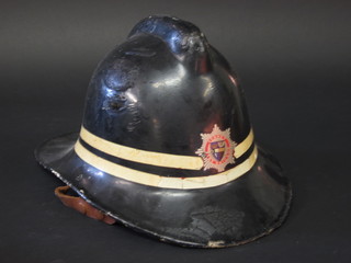 A 1960's Surrey Fire Brigade fireman's helmet