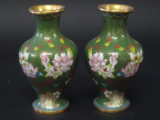 A pair of green ground cloisonne vases with floral decoration 8"