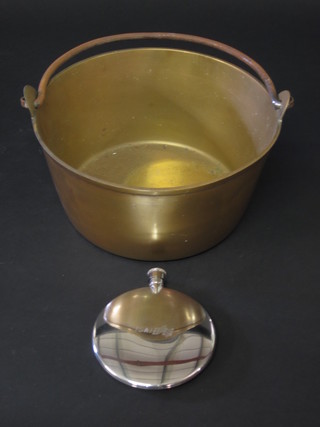 A circular polished pewter hip flask marked ISM and a brass preserving pan with steel handle