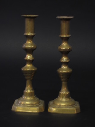 A pair of cast brass candlesticks 10"
