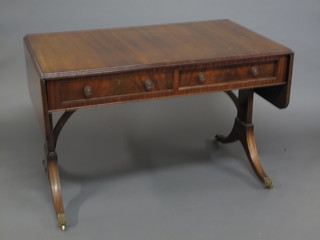 A Georgian style mahogany sofa table fitted 2 drawers and raised  on standard end supports 44"